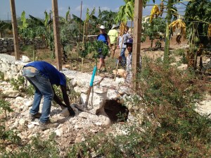 Doug, Charles, Pierre, & Junior working on the orphanage garden