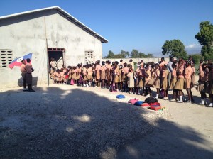 All of the children gathered outside the school for the pledge and national anthem before school.