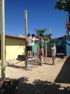 Pensacola & Laurens men working with Makil on the orphanage shade area