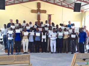 The pastors that attended the pastors' conference showing off their certificates at the end of the conference.