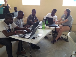 The UA Culverhouse School of Business working with people from the village on computer programs